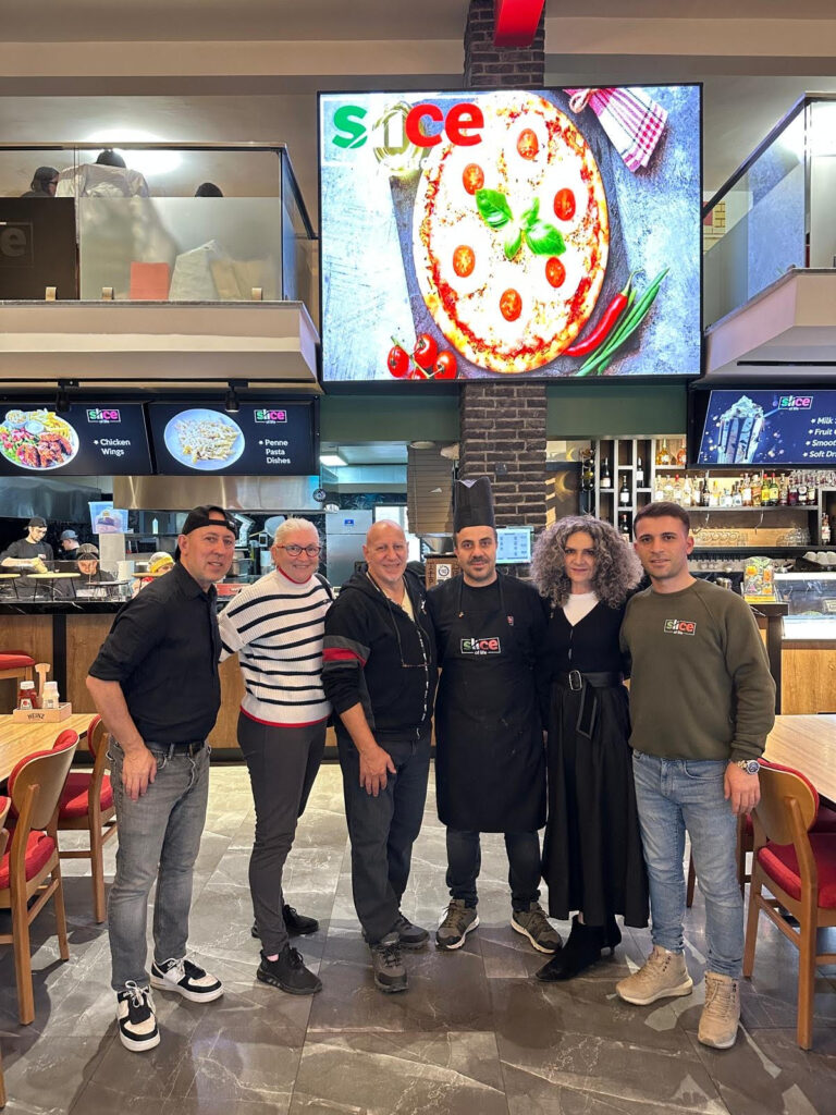 The Tanyel's Smile team and the chef at the restuarant